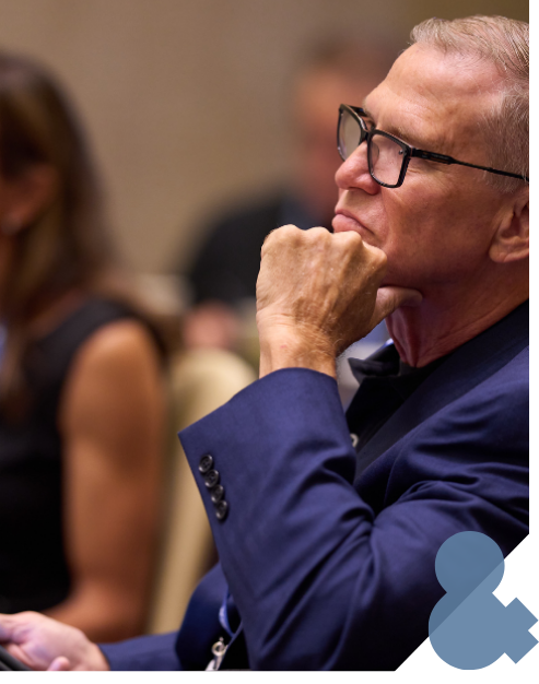 A man listening to a presentation