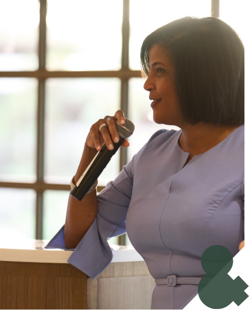 A woman speaking into a microphone